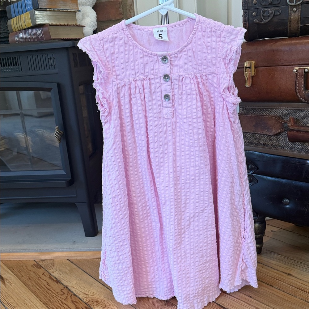Pink textured seersucker dress is from the brand stem.Size 5